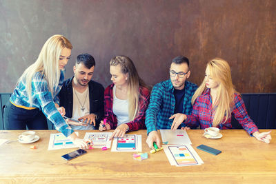 Group of people with text on table