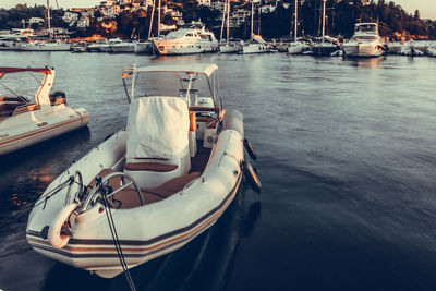 Motorboats moored on harbor