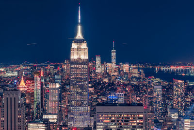 Illuminated buildings in city at night