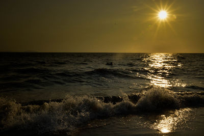 Scenic view of sea against clear sky during sunset