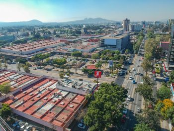High angle view of buildings in city against sky