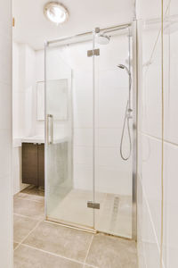 Low angle view of shower head in bathroom