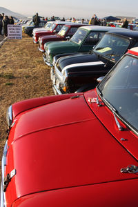 Close-up of red car on field