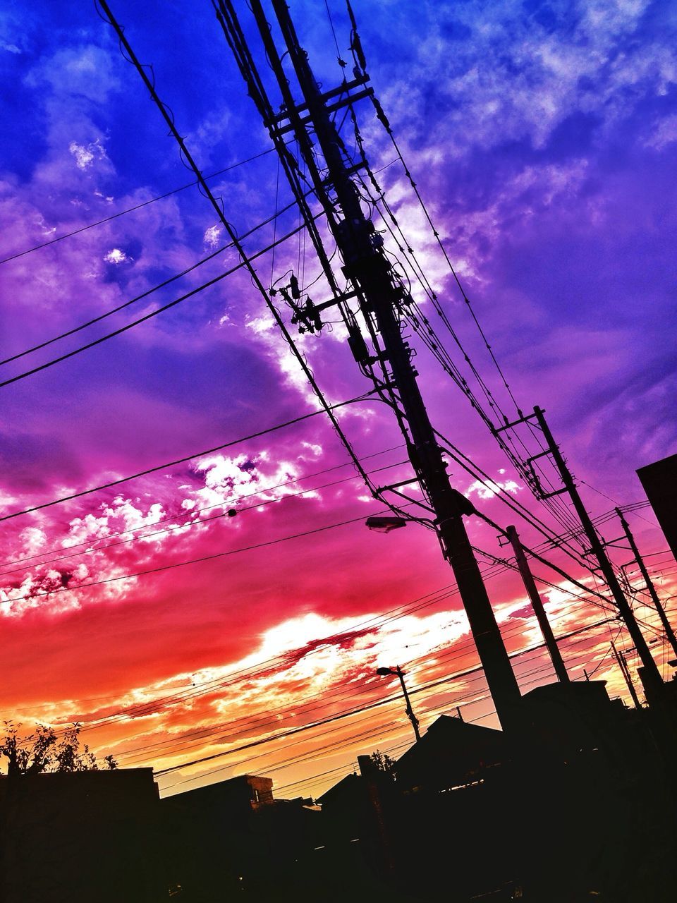 sky, power line, sunset, cloud - sky, silhouette, low angle view, electricity pylon, electricity, cable, power supply, cloud, cloudy, orange color, dramatic sky, blue, connection, dusk, beauty in nature, nature, power cable