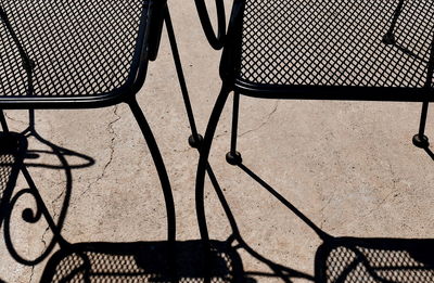 High angle view of empty chair on sunny day