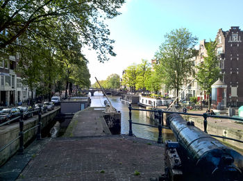 View of river in city against clear sky