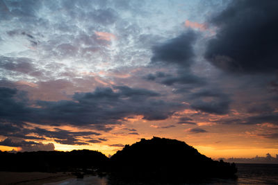 Scenic view of dramatic sky over sea during sunset