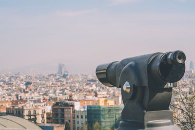 Observation platform with binoculars overlooking sagrada de familia in barcelona