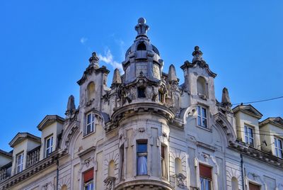 Low angle view of building against blue sky