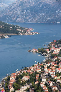 High angle view of townscape by sea