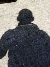 High angle view of shadow on street in city