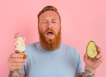 Portrait of man holding ice cream