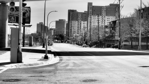 Street amidst buildings in city against sky