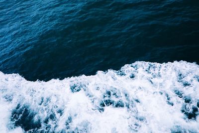 High angle view of waves splashing in sea