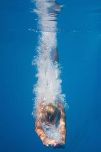 Woman swimming in pool