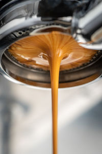 Low angle view of coffee pouring