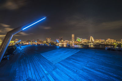 Illuminated osanbashi wooden deck at night in yokohama.