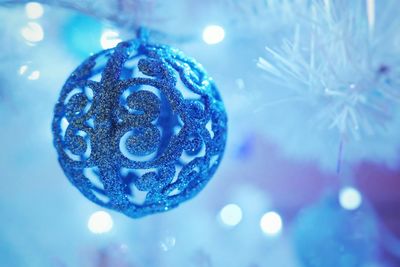 Close-up of illuminated christmas bauble