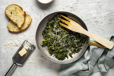 Buttered spinach in a pan with handle