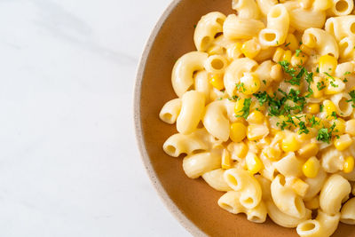 Close-up of pasta in bowl on white background