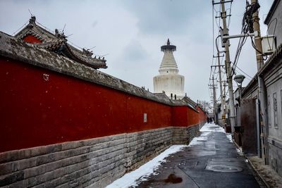 Building against sky during winter