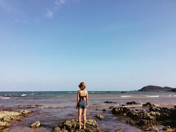 Woman standing on beach