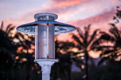 Low angle view of street light against sky during sunset