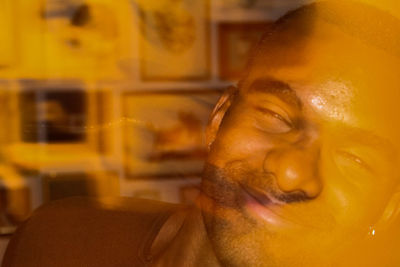 Close-up portrait of young man at home