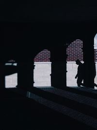 Full length of woman standing on railing