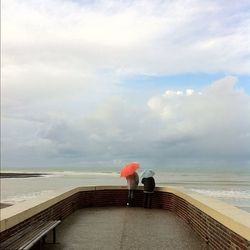 Scenic view of sea against cloudy sky