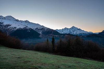 Scenic view of snowcapped mountains against sky