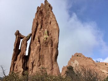 Low angle view of rock formation against sky