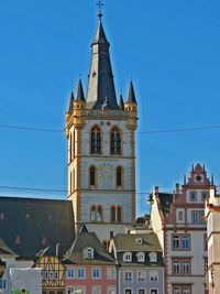 Low angle view of building against clear blue sky
