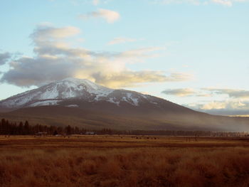 Scenic view of snowcapped mountains against sky