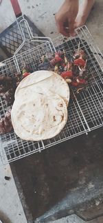 High angle view of person preparing food on barbecue grill