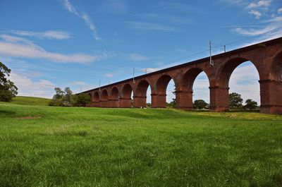 Arch bridge against blue sky