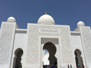 Low angle view of mosque against clear sky