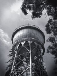 Low angle view of tower against cloudy sky