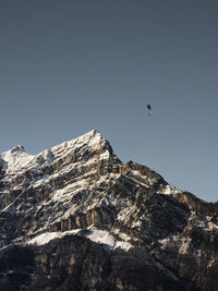 Low angle view of mountain range against clear sky