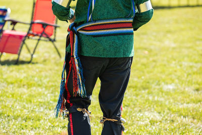 Rear view of man standing on field