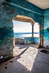 Scenic view of beach by sea against sky