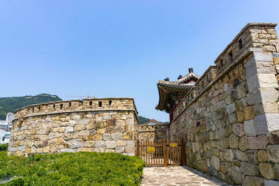 View of old building against blue sky