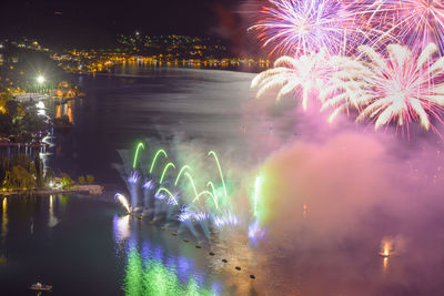 Firework display in city at night