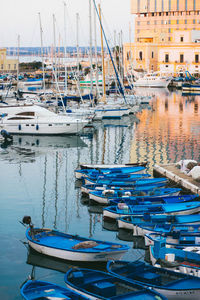 Boats moored at harbor