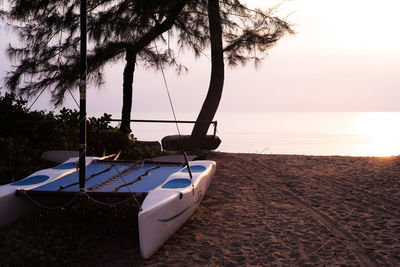 Scenic view of beach against sky during sunset