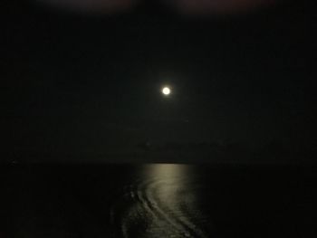 Scenic view of sea against sky at night