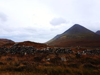 View of landscape against cloudy sky