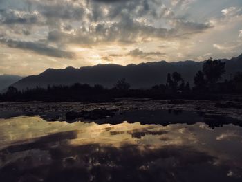 View of lake against cloudy sky