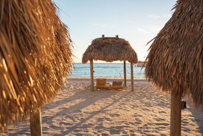  hut on beach against sky