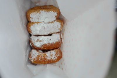 High angle view of donuts in paper bag